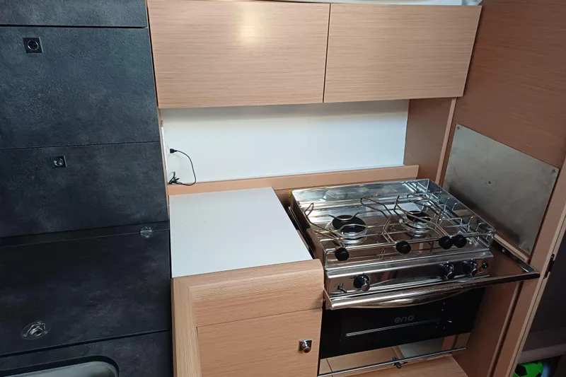 Prima Yacht Photos Pics 2024 Jeanneau Sun Odyssey 349 yacht kitchen with modern stove and sleek cabinetry.