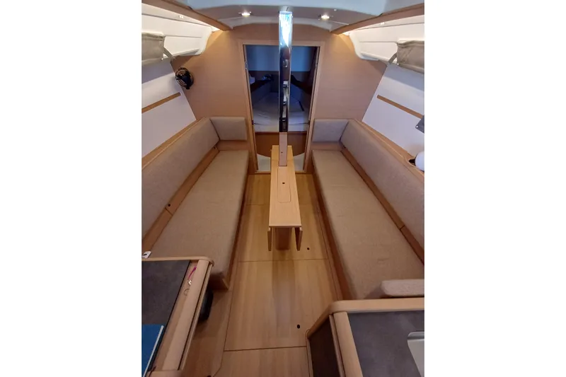Prima Yacht Photos Pics Interior of 2024 Jeanneau Sun Odyssey 349 sailboat, featuring cozy seating and modern design.