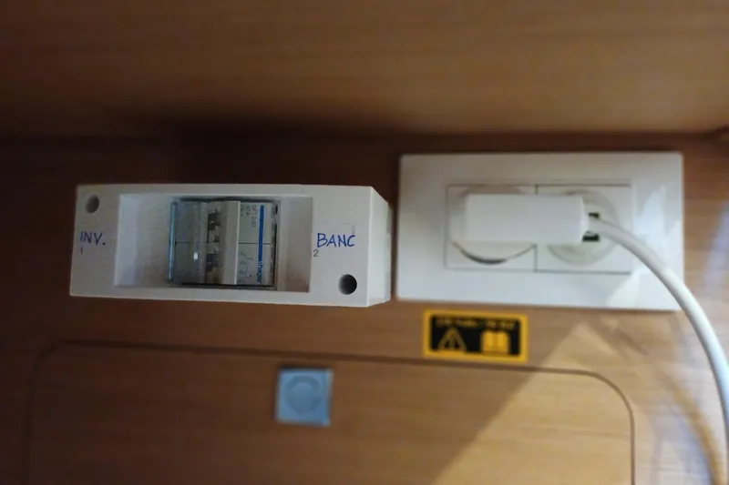 Prima Yacht Photos Pics Electrical panel and outlet inside 2024 Jeanneau Sun Odyssey 349 yacht cabin.