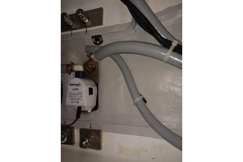 Prima Yacht Photos Pics Bilge pump system in 2024 Jeanneau Sun Odyssey 349 yacht, featuring Sahara S1200 pump and hoses.