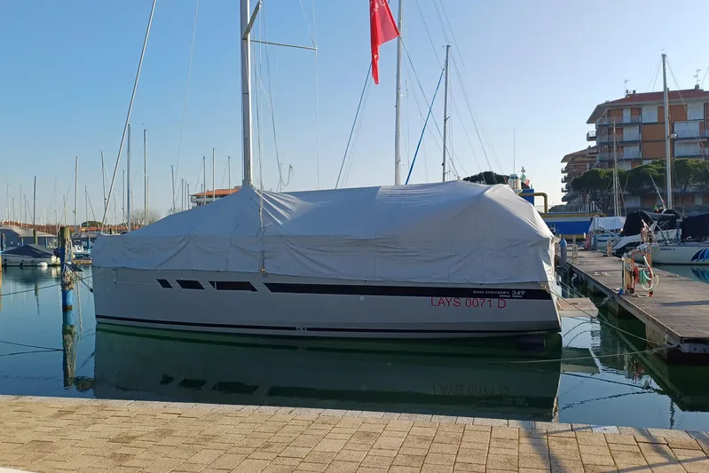 Prima Yacht Photos Pics 2024 Jeanneau Sun Odyssey 349 sailboat covered at marina dock.