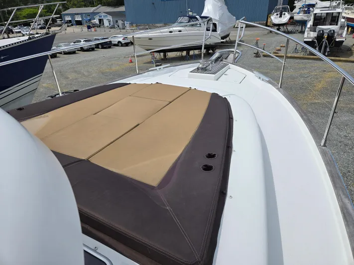 First Mates Yacht Photos Pics 2015 Beneteau Swift Trawler 44 with sunpad, docked in a marina.