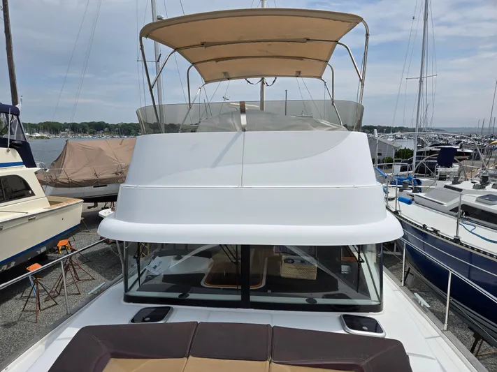 First Mates Yacht Photos Pics 2015 Beneteau Swift Trawler 44 with flybridge, docked in a marina.
