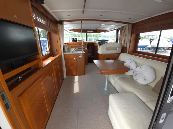 First Mates Yacht Photos Pics Interior of 2015 Beneteau Swift Trawler 44 with cozy seating and modern amenities.