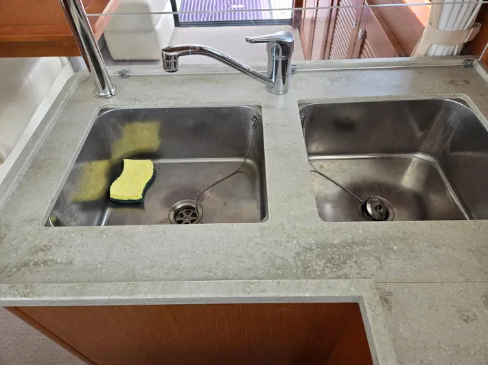 First Mates Yacht Photos Pics Stainless steel double sink in 2015 Beneteau Swift Trawler 44 kitchen area.