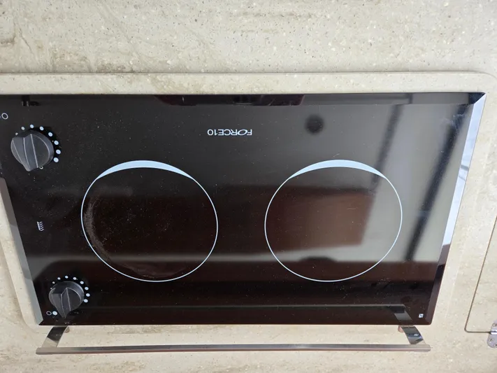 First Mates Yacht Photos Pics Stovetop on 2015 Beneteau Swift Trawler 44 yacht, featuring dual burners and sleek design.