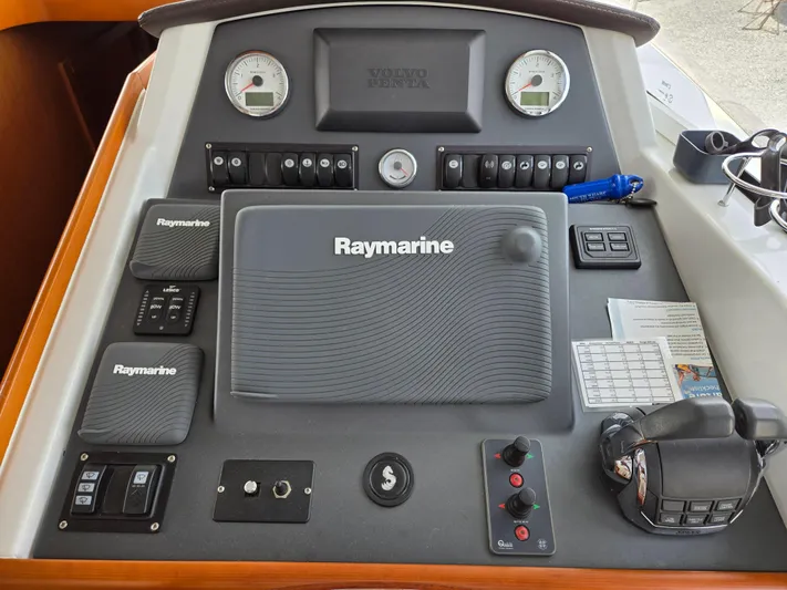 First Mates Yacht Photos Pics Control panel of 2015 Beneteau Swift Trawler 44 with Raymarine navigation equipment.