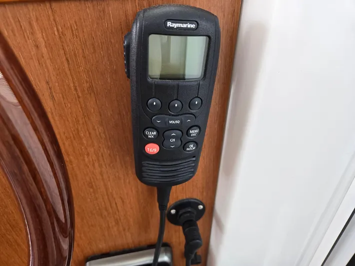 First Mates Yacht Photos Pics Raymarine marine radio on 2015 Beneteau Swift Trawler 44 wooden interior panel.