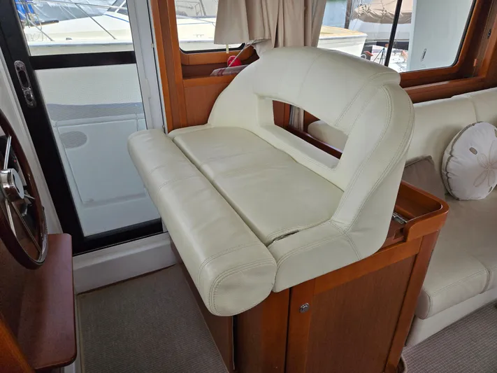 First Mates Yacht Photos Pics Interior of 2015 Beneteau Swift Trawler 44 with white leather seating.
