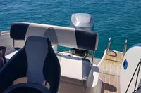 Quicksilver 600 Commander boat interior with seating, 2007 model, on clear blue water.