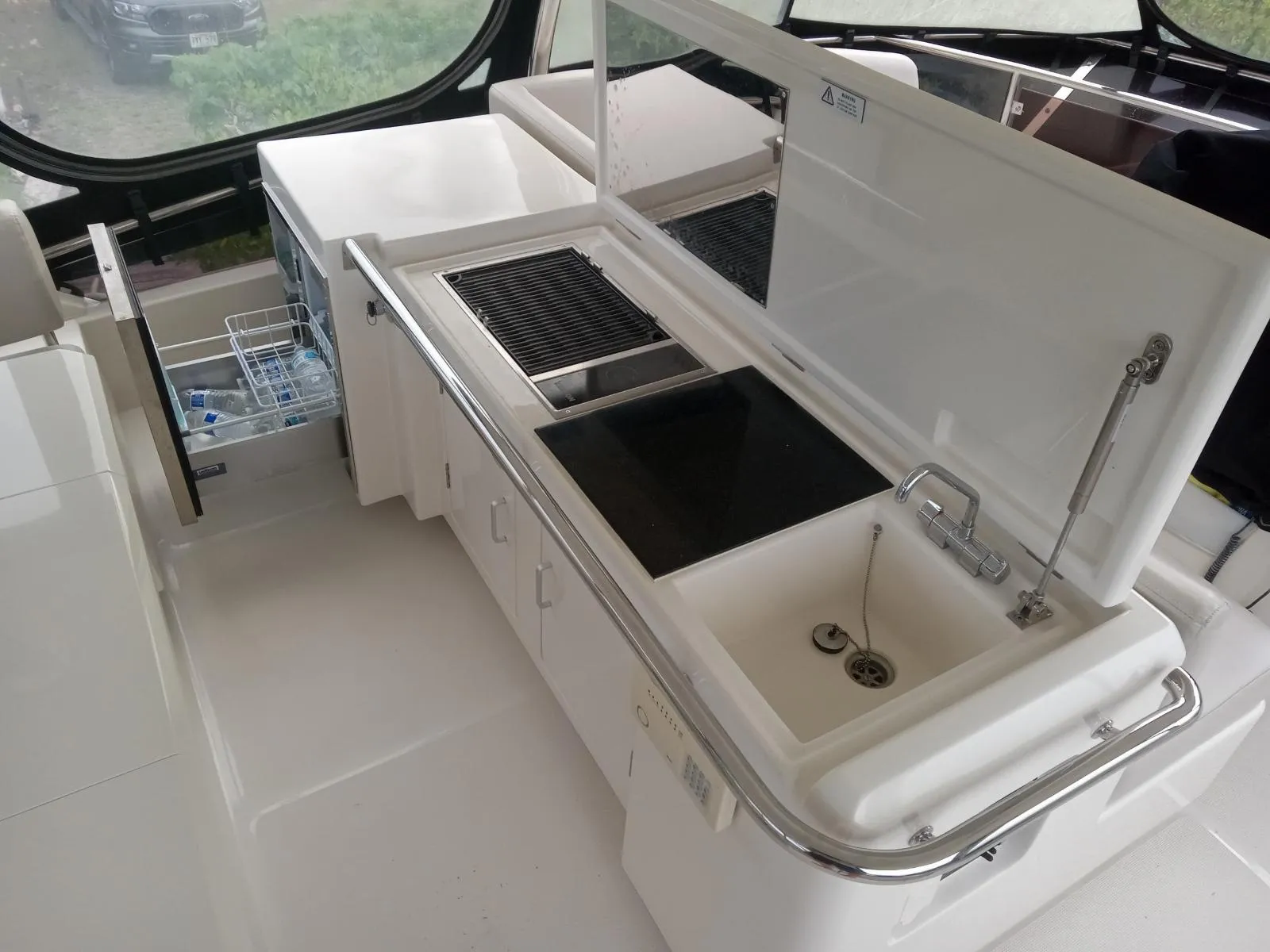 Modern kitchen area on 2016 Aquila 44 yacht with sink and grill.