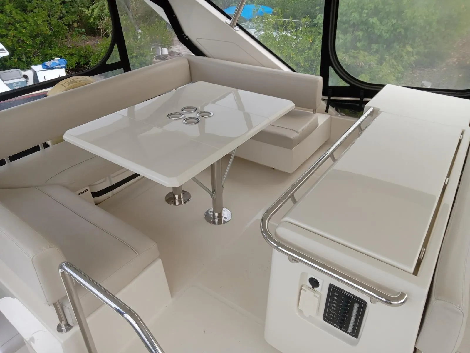 Luxurious interior of 2016 Aquila 44 yacht with elegant seating and table.