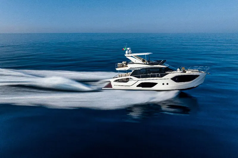  Yacht Photos Pics Luxury Absolute 52 FLY yacht cruising on open sea, 2026 model.