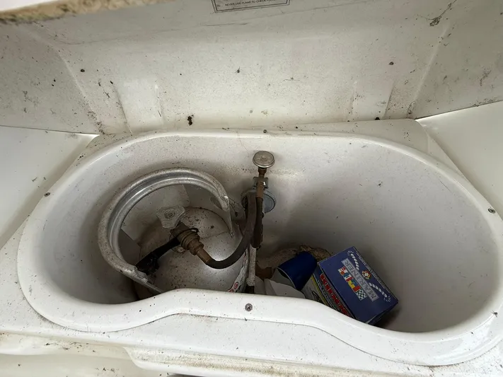 French Angel Yacht Photos Pics Storage compartment on a 2003 Beneteau 393 sailboat with propane tank and supplies.