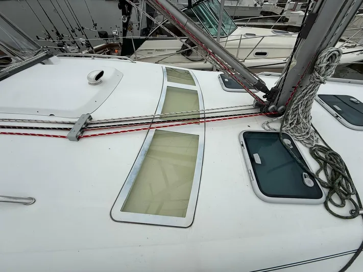 French Angel Yacht Photos Pics Deck of a 2003 Beneteau 393 sailboat with rigging and hatches.