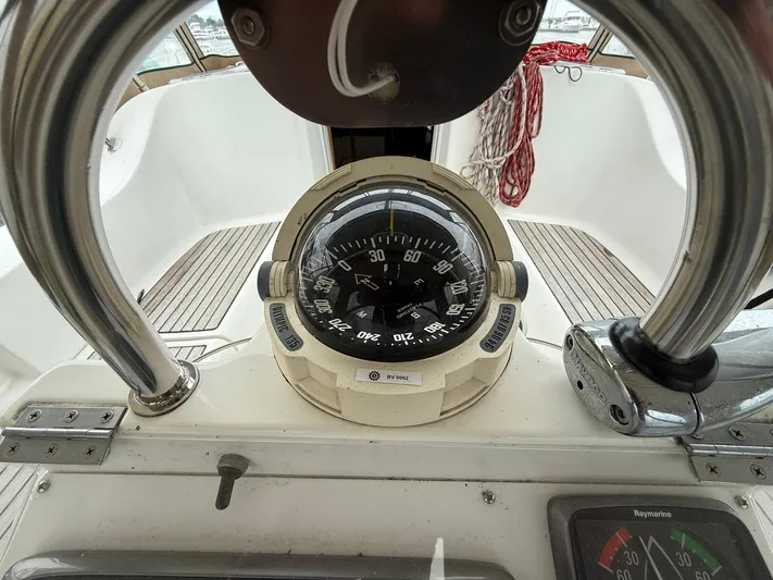French Angel Yacht Photos Pics Compass and navigation instruments on a 2003 Beneteau 393 sailboat.