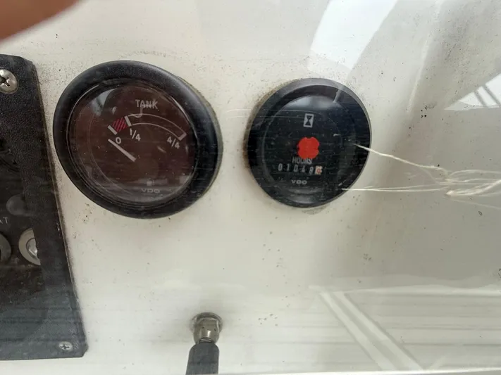French Angel Yacht Photos Pics Close-up of Beneteau 393 2003 boat gauges, showing tank and hour meters.