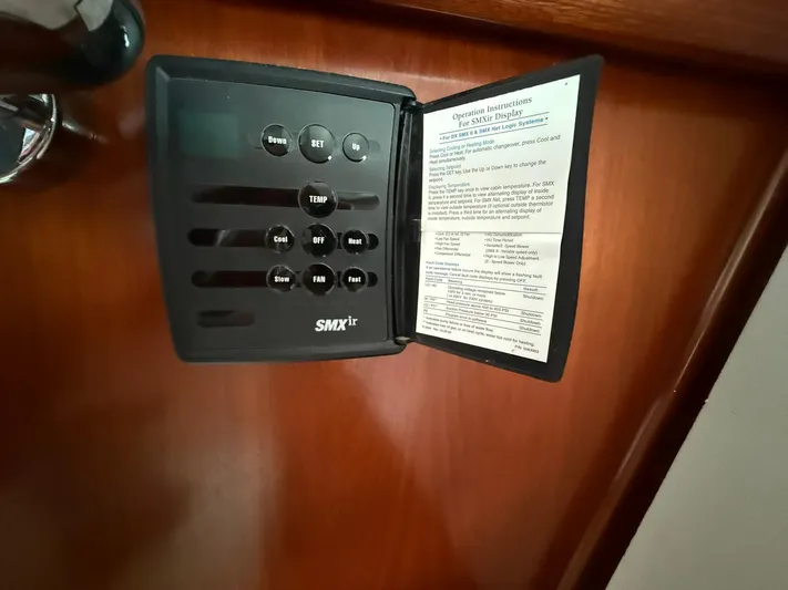 French Angel Yacht Photos Pics SMXir control panel on 2003 Beneteau 393 yacht, featuring temperature and fan settings.