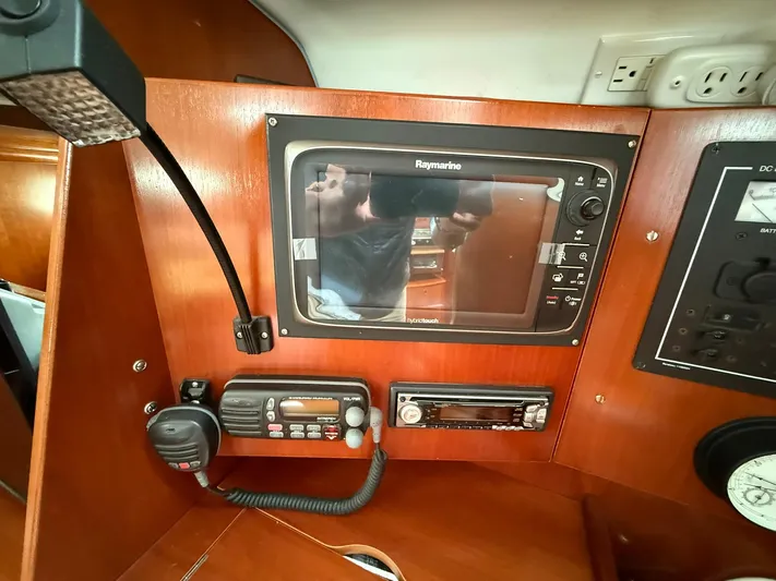 French Angel Yacht Photos Pics Control panel of a 2003 Beneteau 393 sailboat with navigation and communication equipment.