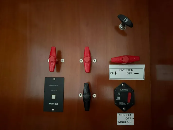 French Angel Yacht Photos Pics Control panel of a 2003 Beneteau 393 sailboat with switches and labels.