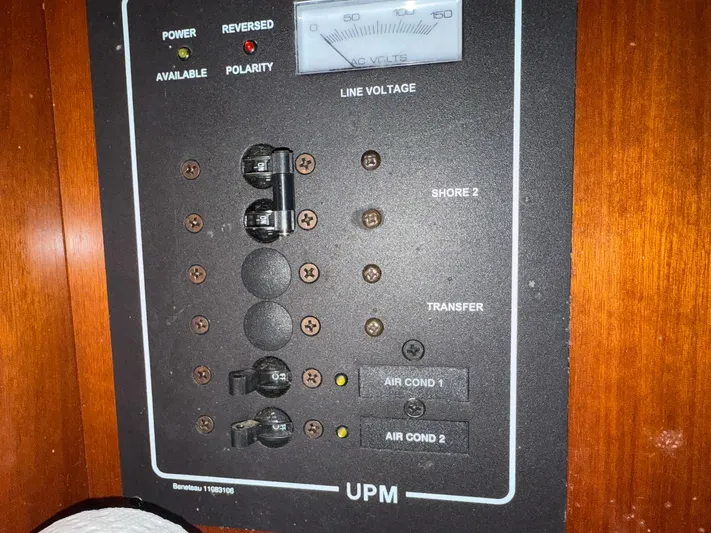 French Angel Yacht Photos Pics Electrical panel of a 2003 Beneteau 393 sailboat, showing line voltage and circuit breakers.