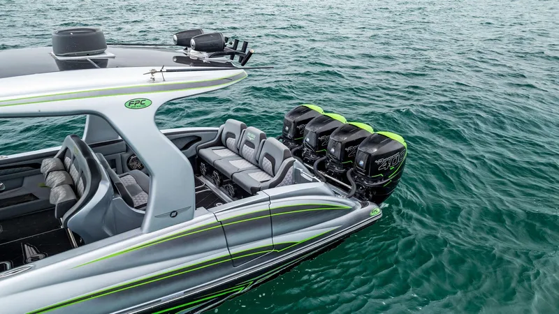 Baby Yacht Photos Pics 2018 Deep Impact 399 Cabin boat with multiple outboard engines on the water.