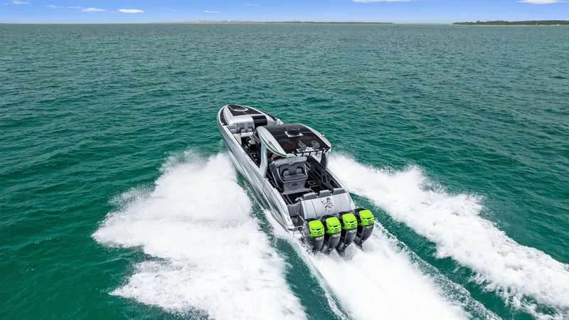 Baby Yacht Photos Pics 2018 Deep Impact 399 Cabin boat cruising on open water.