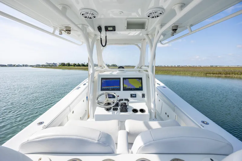  Yacht Photos Pics 2019 Yellowfin 36 boat interior with dual navigation screens on calm water.