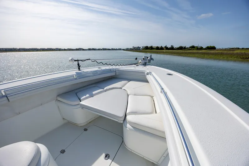  Yacht Photos Pics 2019 Yellowfin 36 boat with white seating, cruising on calm waters under a clear sky.
