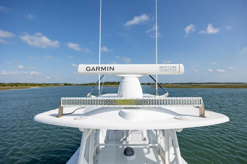  Yacht Photos Pics 2019 Yellowfin 36 boat with Garmin radar on calm water under blue sky.