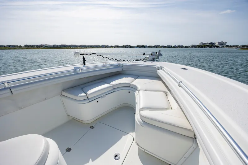  Yacht Photos Pics 2019 Yellowfin 36 boat with white seating, on calm water, clear sky background.