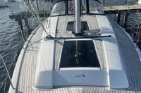 2023 Hanse 388 yacht docked at marina, showcasing sleek deck design.