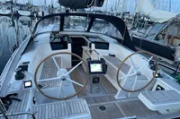 2023 Hanse 388 yacht cockpit with dual steering wheels and navigation equipment.
