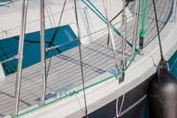 2023 Hanse 388 sailboat deck with rigging and fender in sunlight.