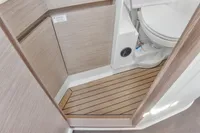 2023 Hanse 388 yacht bathroom with wooden flooring and modern toilet design.