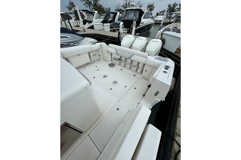  Yacht Photos Pics 2016 Boston Whaler 370 Outrage boat deck with seating and outboard motors.