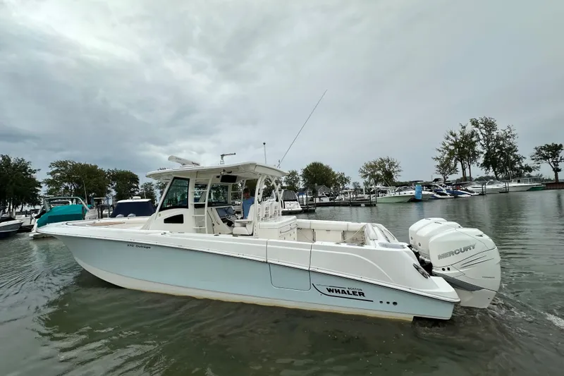  Yacht Photos Pics 2016 Boston Whaler 370 Outrage boat on water, featuring twin Mercury engines.