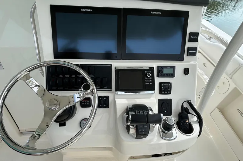  Yacht Photos Pics 2016 Boston Whaler 370 Outrage helm with dual Raymarine displays and controls.