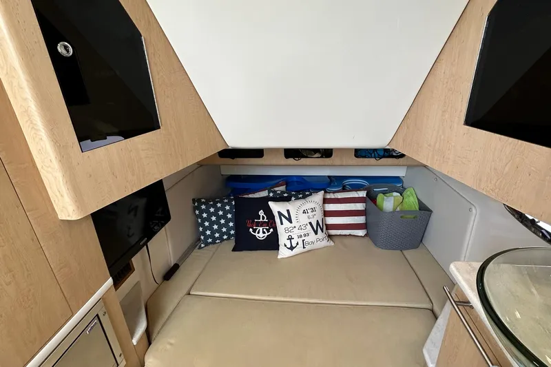  Yacht Photos Pics Interior cabin of 2016 Boston Whaler 370 Outrage with nautical-themed decor.