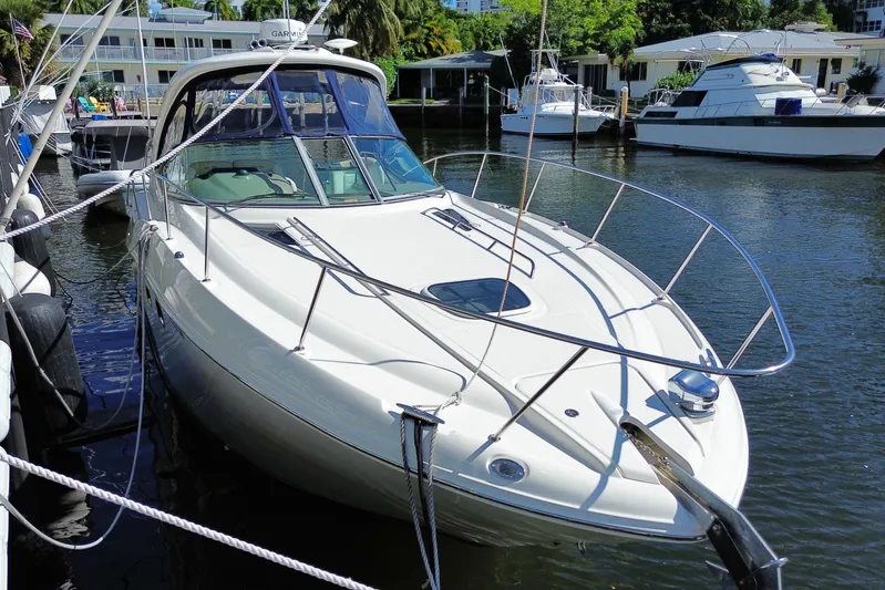  Yacht Photos Pics 2008 Sea Ray Sundancer 330 yacht docked in a marina, surrounded by other boats.