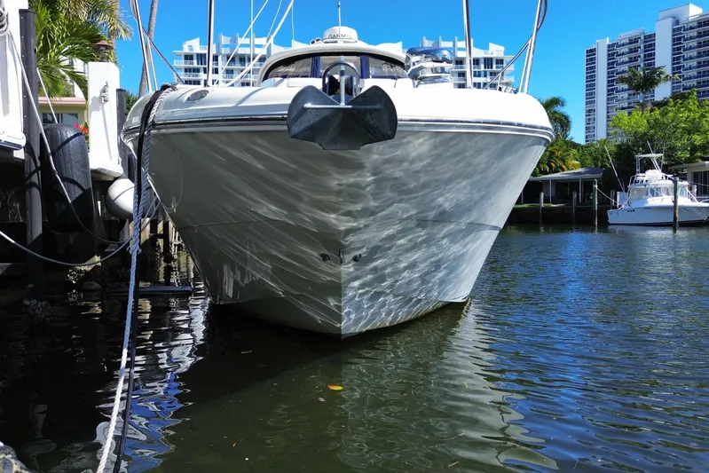  Yacht Photos Pics 2008 Sea Ray Sundancer 330 docked in a marina with cityscape background.
