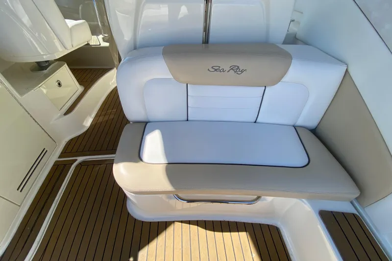  Yacht Photos Pics 2008 Sea Ray Sundancer 330 interior with beige and white seating on teak flooring.