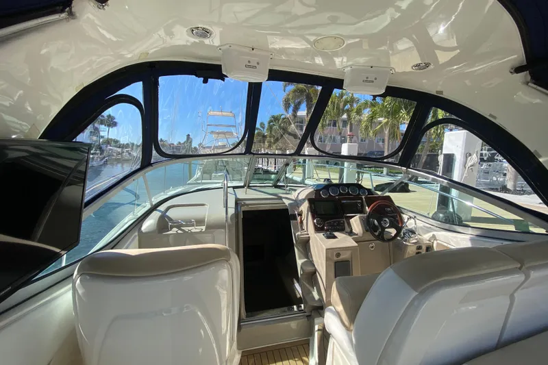  Yacht Photos Pics Interior view of 2008 Sea Ray Sundancer 330 yacht cockpit with steering and controls.