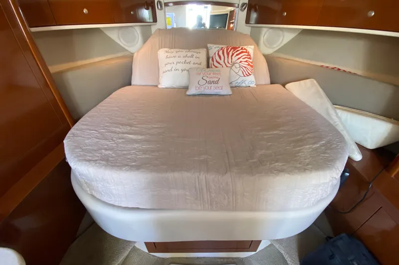  Yacht Photos Pics 2008 Sea Ray Sundancer 330 cabin with cozy bed and decorative pillows.