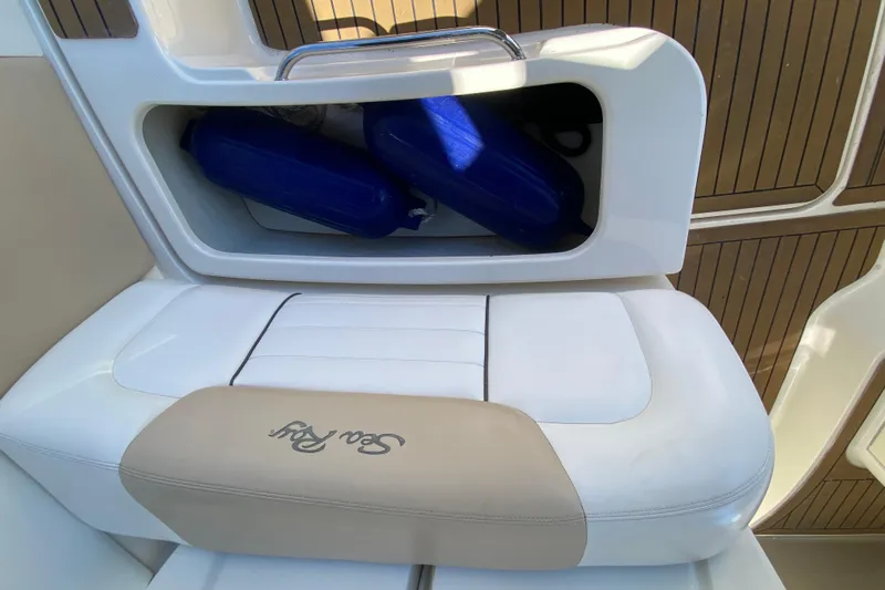  Yacht Photos Pics 2008 Sea Ray Sundancer 330 boat seat with storage compartment and blue fenders.
