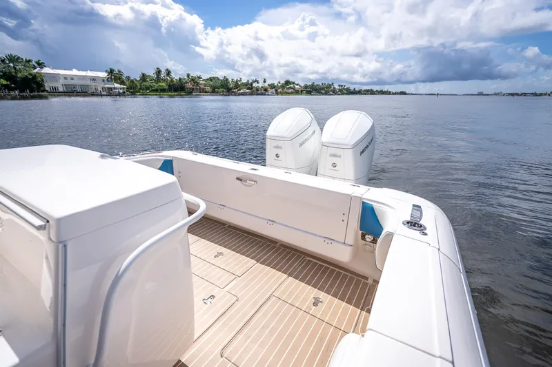  Yacht Photos Pics 2018 Intrepid 407 boat with dual Mercury engines on a serene waterway.