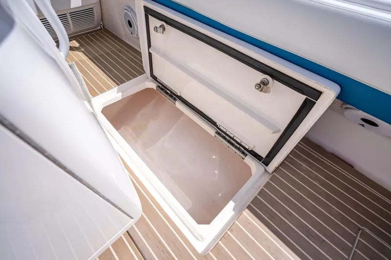  Yacht Photos Pics Open storage compartment on 2018 Intrepid 407 boat, featuring sleek design and spacious interior.