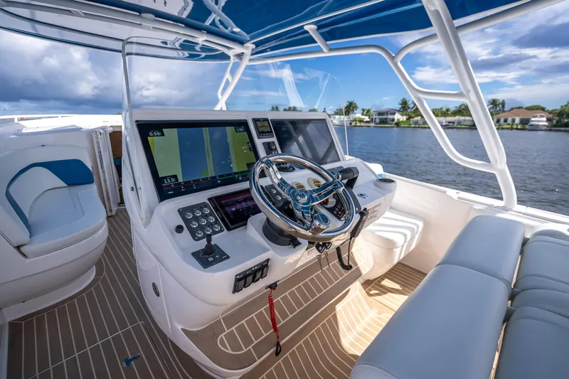  Yacht Photos Pics 2018 Intrepid 407 boat helm with advanced navigation system and luxurious seating.