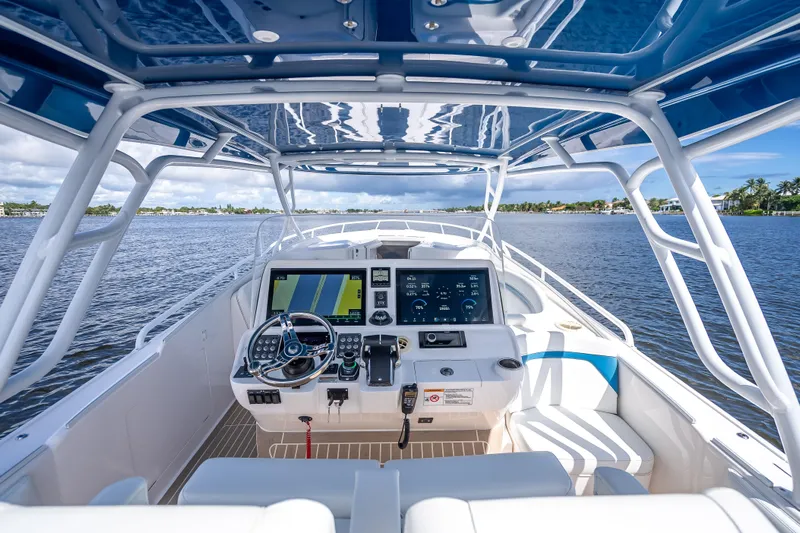  Yacht Photos Pics Cockpit view of 2018 Intrepid 407 boat with advanced navigation system on open water.