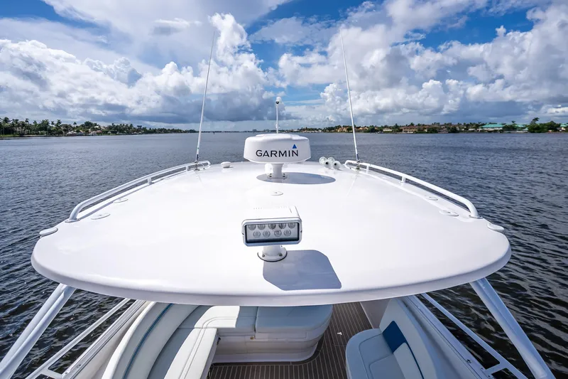  Yacht Photos Pics 2018 Intrepid 407 boat with Garmin equipment on open water under cloudy sky.